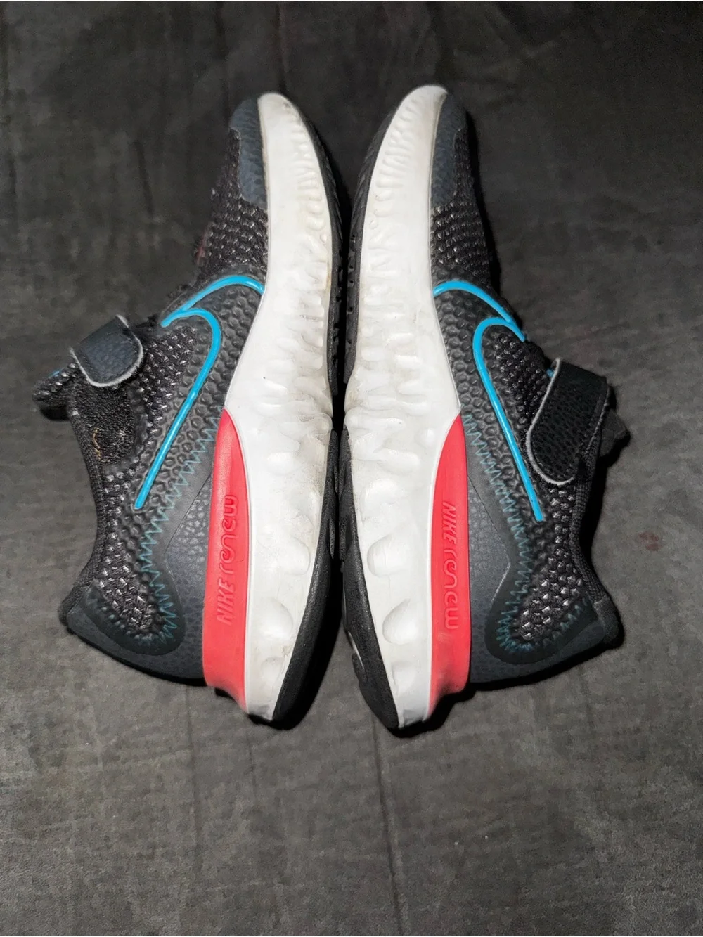 Renew Nike Kids size 13. Running Black Sneakers with Blue and neon pink .